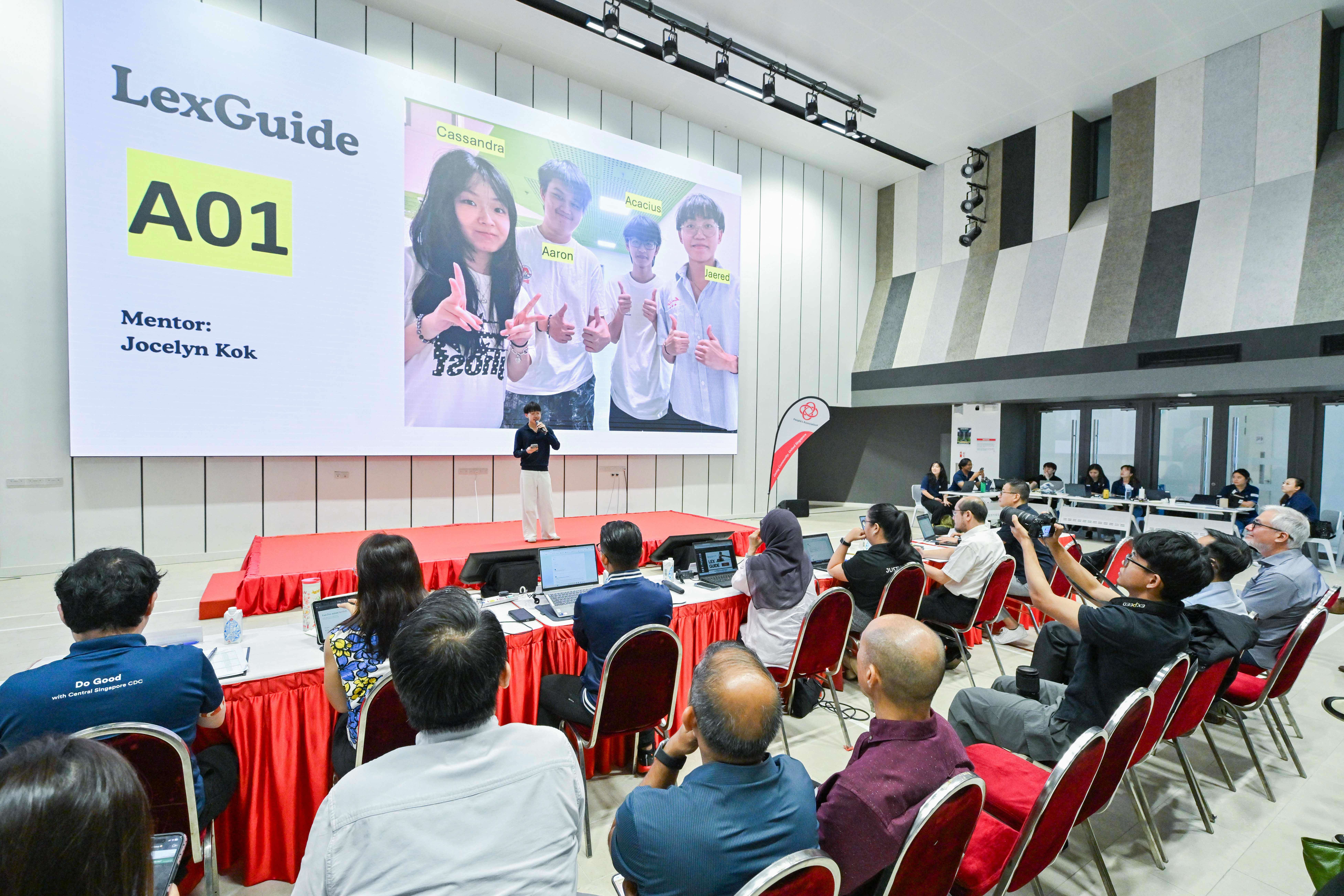Member of LexGuide group explaining to the audience and panel